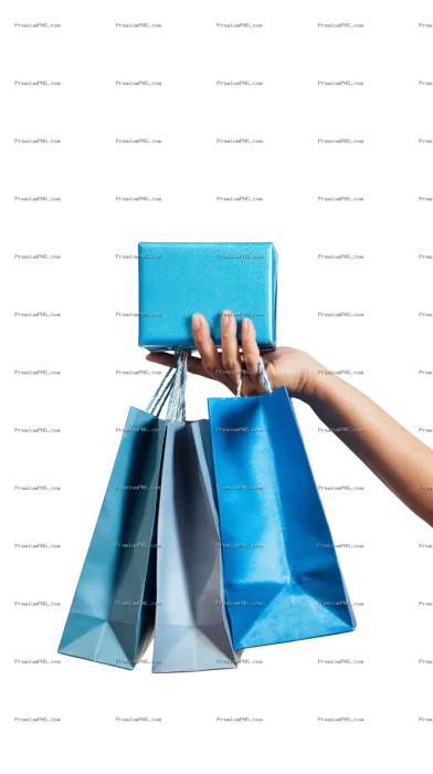 A close-up shot of a hand holding a blue gift box with mini shopping bags hanging on fingers against