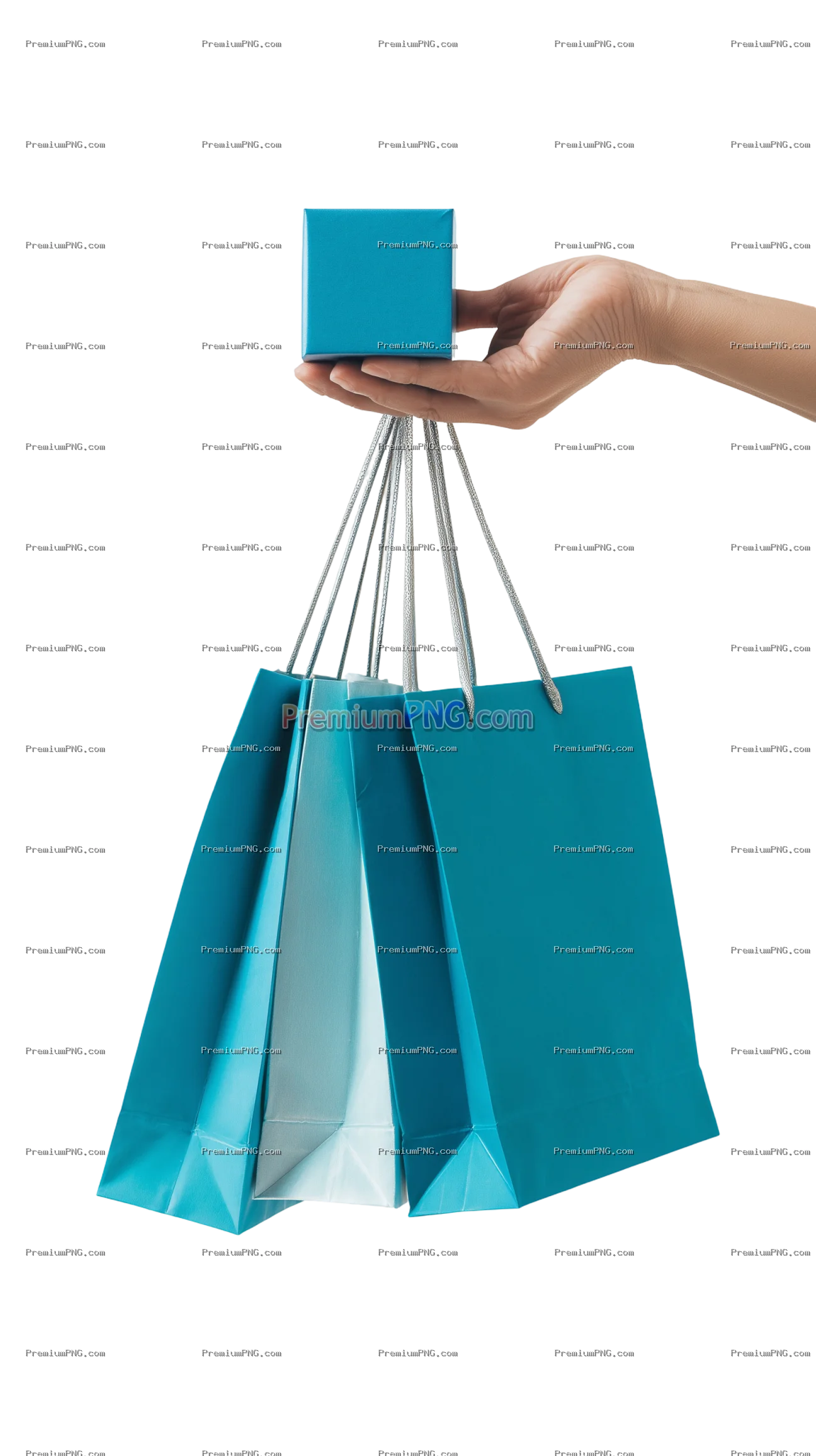 A close up shot of a hand holding a blue gift box with shopping bags hanging on the fingers