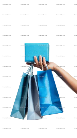 A close-up shot of a hand holding a blue gift box with mini shopping bags hanging on fingers against